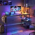 Bestier Gaming Desk with LED Lights, 51.3 Inch Computer Desk with 4 Tiers Reversible Shelves, Home Office Writing Desk with Side Storage Bag, Hooks and Height Adjustable Shelf (Black Grained) by Bestier